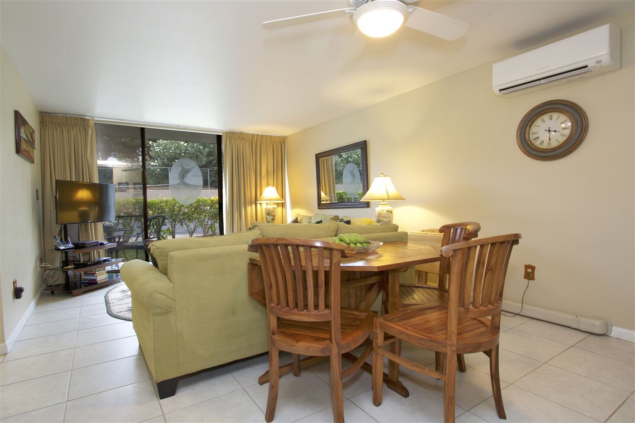 2219 South Kihei Road, Unit B102 Kihei, HI 96753 - Photo 15 of 30 a view of a dining room with furniture and a large window