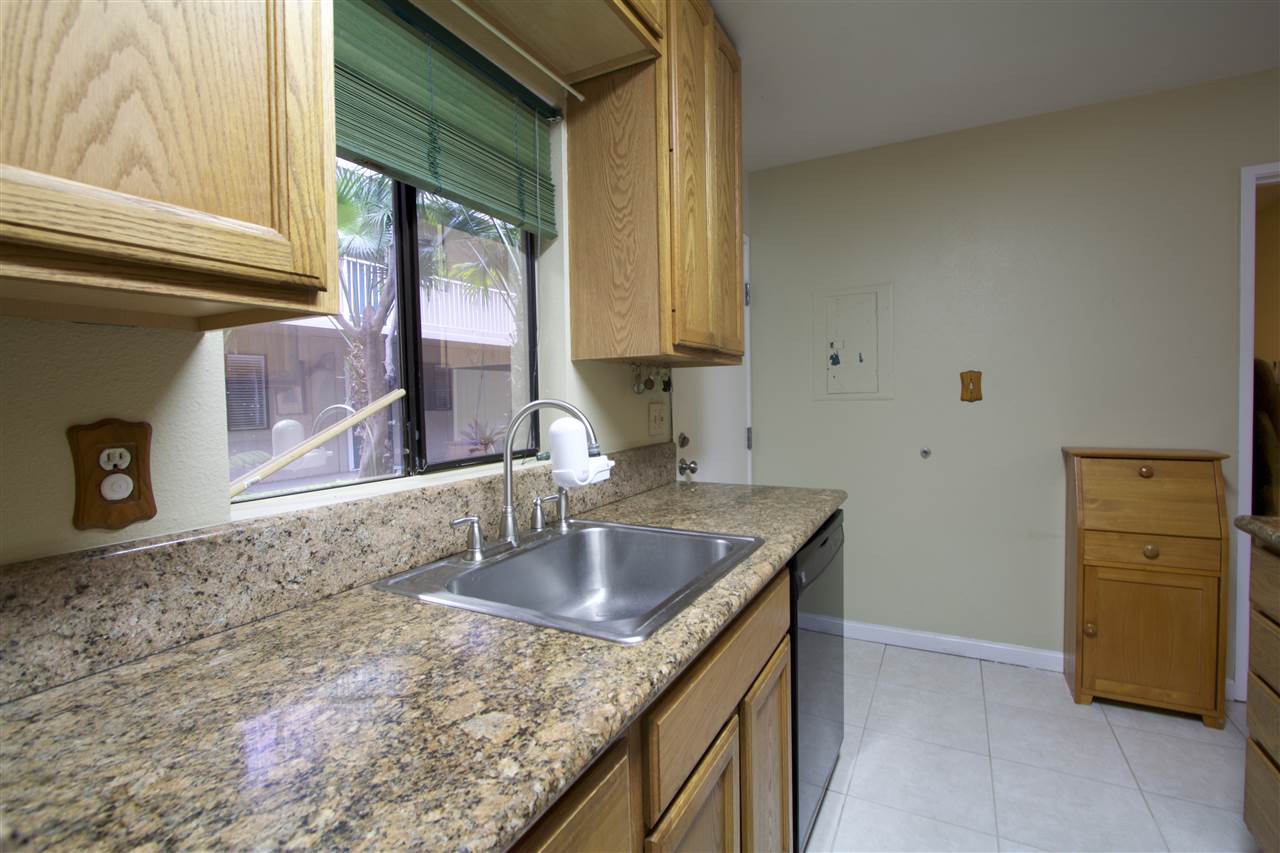 2219 South Kihei Road, Unit B102 Kihei, HI 96753 - Photo 17 of 30 a bathroom with a granite countertop sink and a mirror