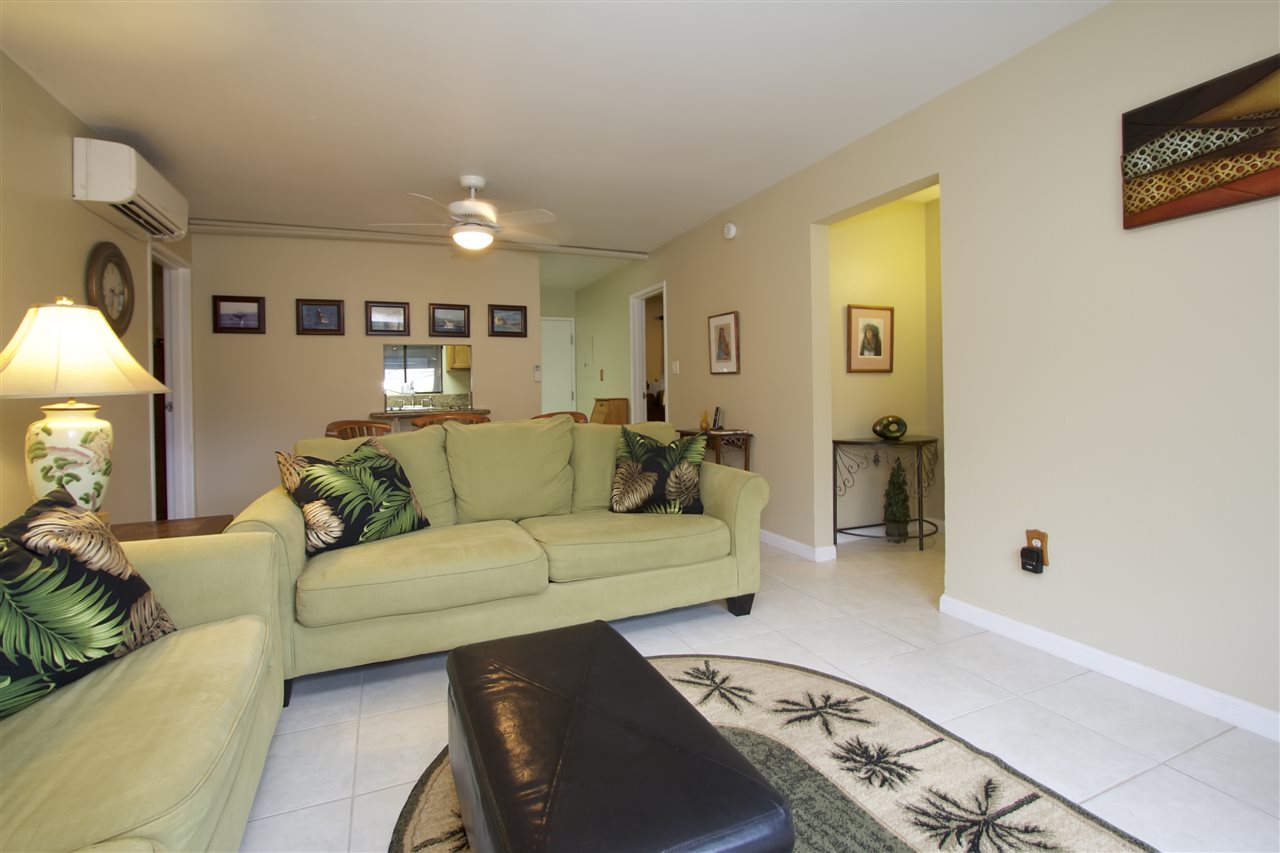 2219 South Kihei Road, Unit B102 Kihei, HI 96753 - Photo 6 of 30 a living room with furniture and a lamp
