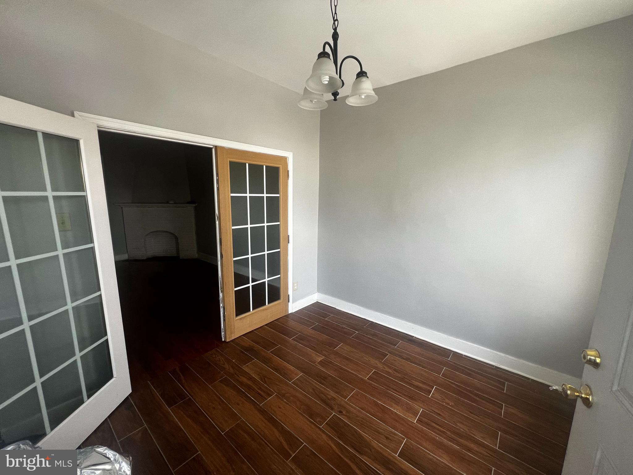 3340 Cottman Avenue Philadelphia, PA 19149 - Photo 17 of 42 a view of an empty room with wooden floor and a window
