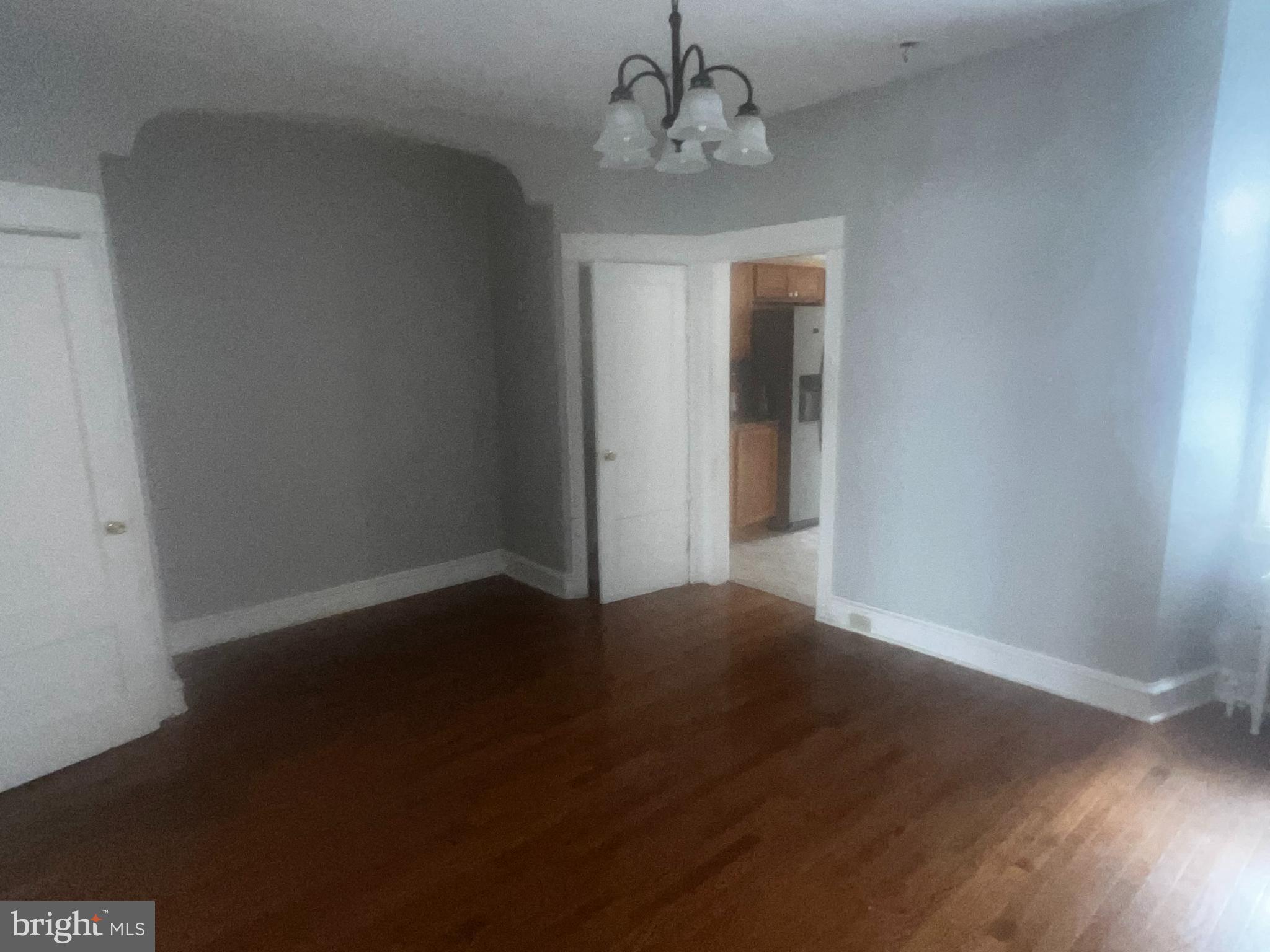 3340 Cottman Avenue Philadelphia, PA 19149 - Photo 22 of 42 a view of an empty room with wooden floor and a window