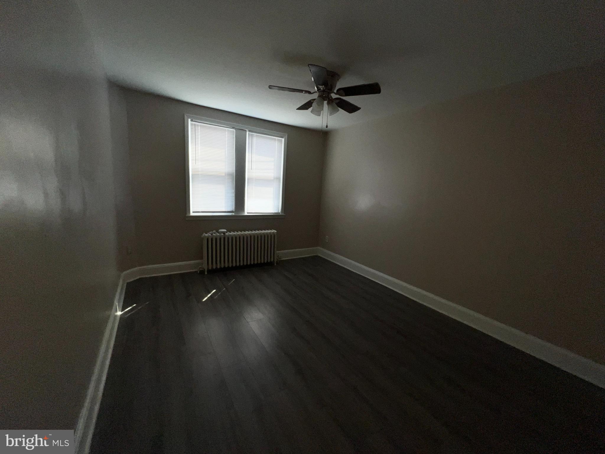 3340 Cottman Avenue Philadelphia, PA 19149 - Photo 30 of 42 wooden floor in an empty room with a window