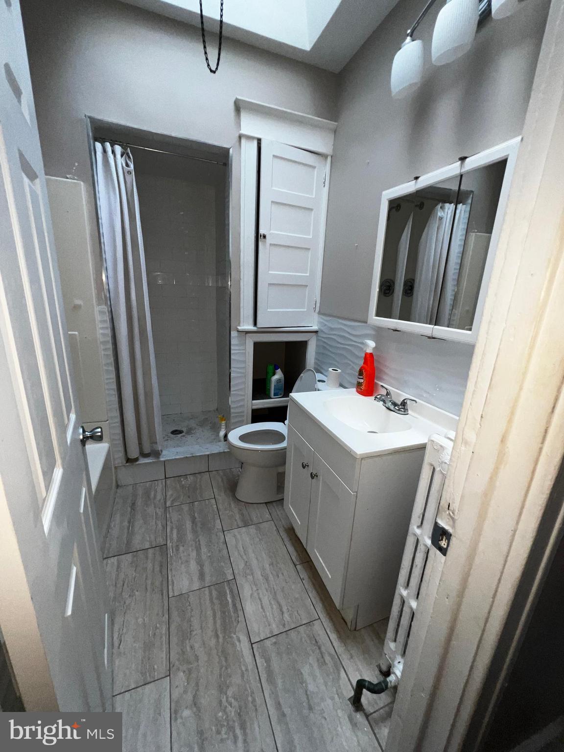 3340 Cottman Avenue Philadelphia, PA 19149 - Photo 34 of 42 a room with a chair and white cabinets