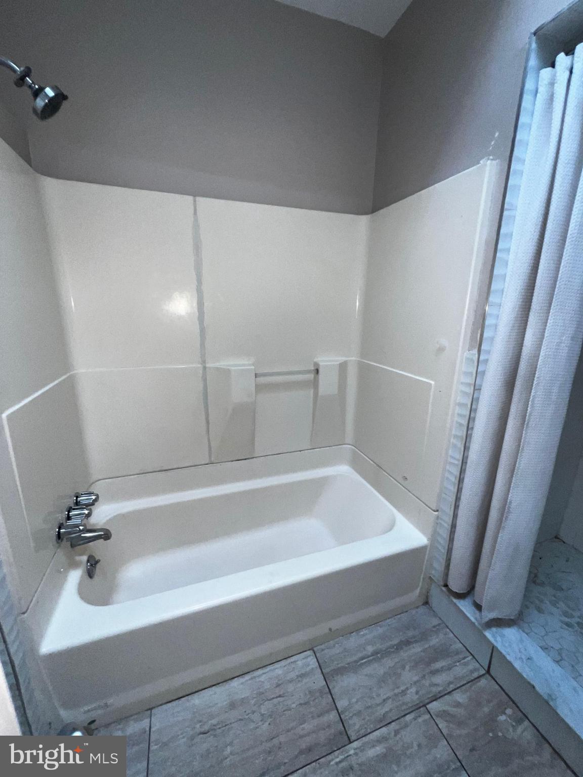 3340 Cottman Avenue Philadelphia, PA 19149 - Photo 35 of 42 a bath tub sitting next to a white sink and vanity