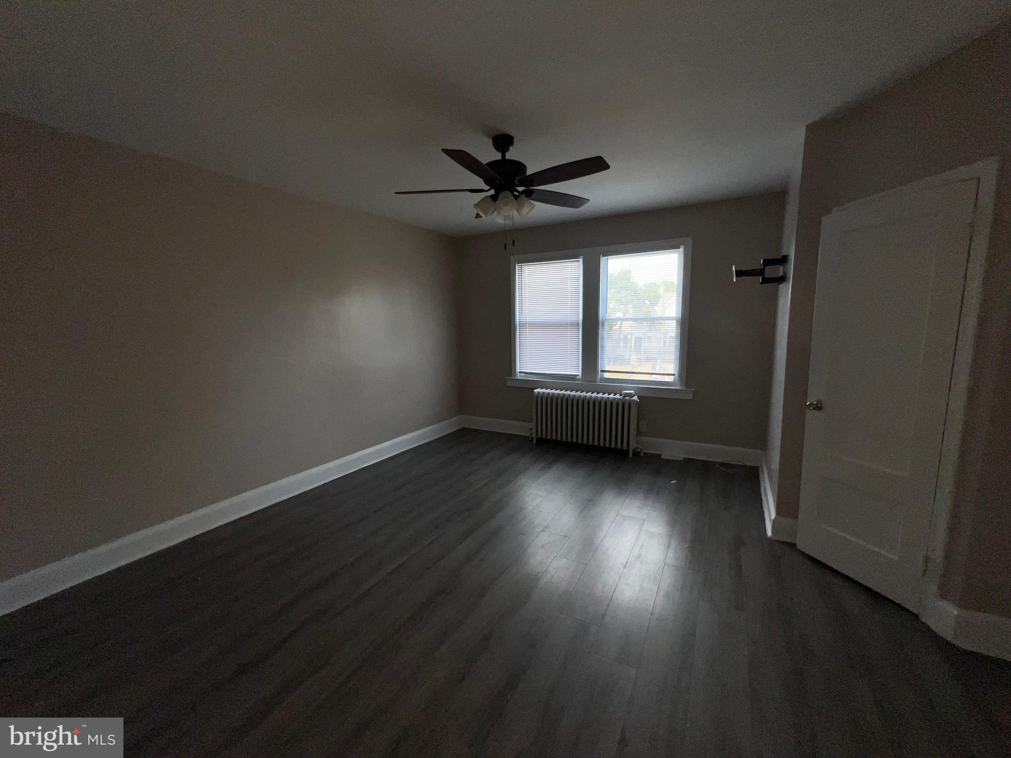 3340 Cottman Avenue Philadelphia, PA 19149 - Photo 36 of 42 an empty room with wooden floor and windows