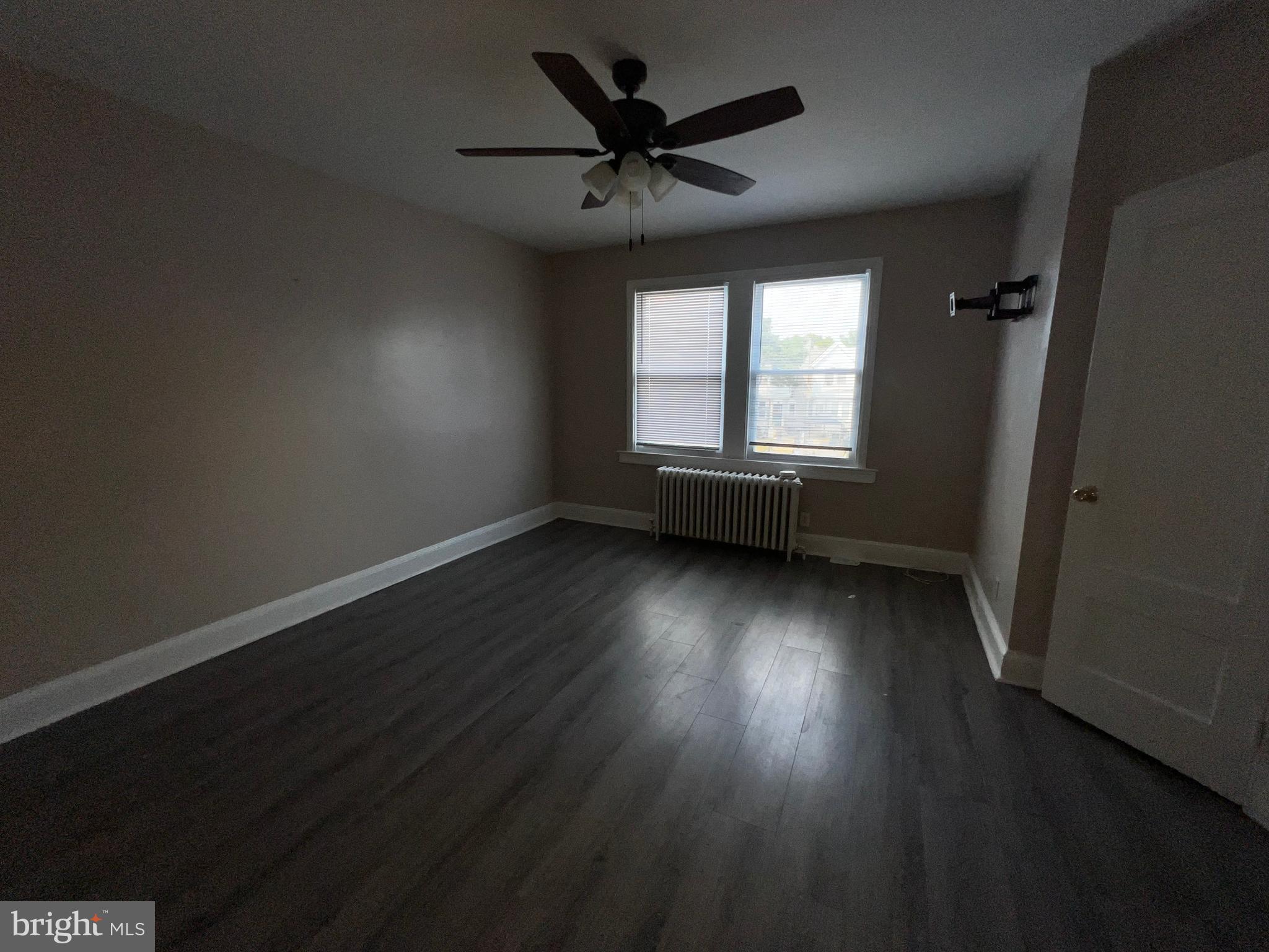 3340 Cottman Avenue Philadelphia, PA 19149 - Photo 37 of 42 an empty room with wooden floor and windows