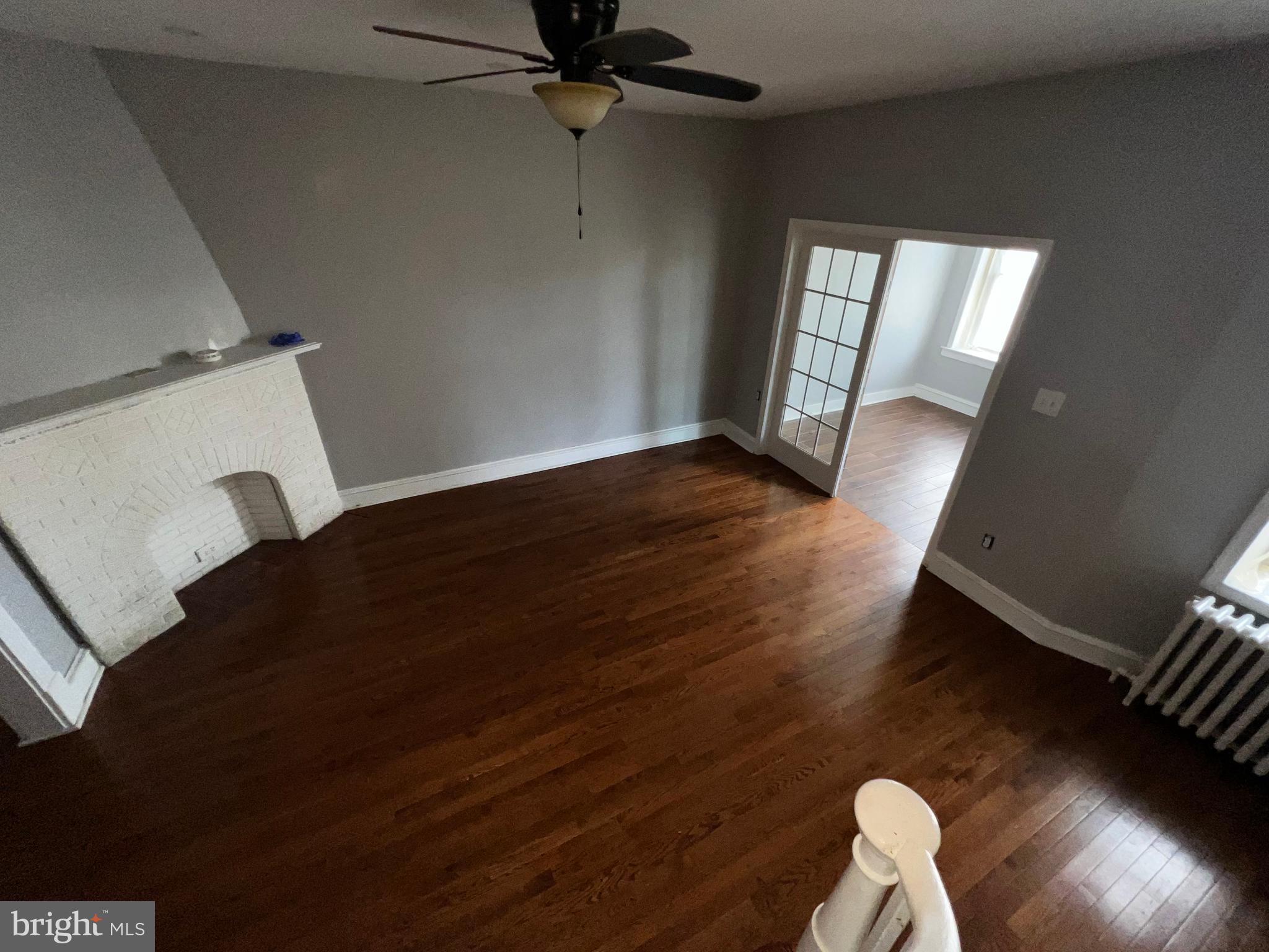 3340 Cottman Avenue Philadelphia, PA 19149 - Photo 39 of 42 a view of wooden floor and windows in an empty room