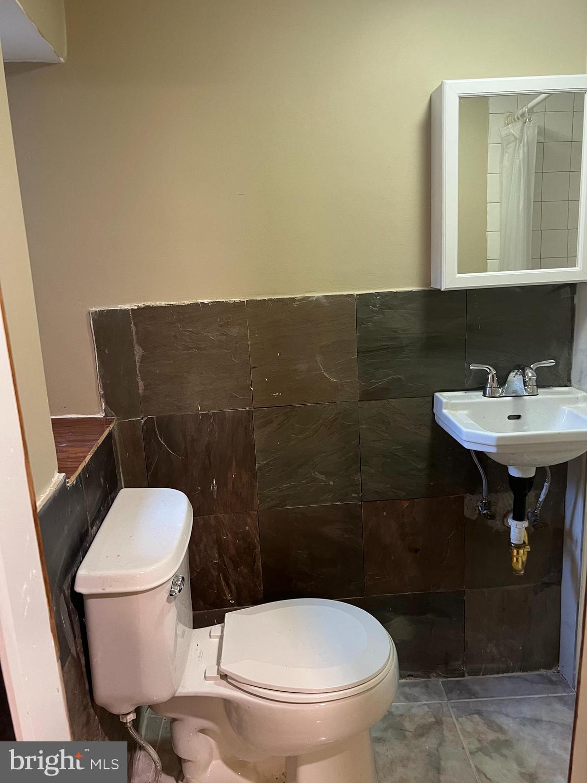 3340 Cottman Avenue Philadelphia, PA 19149 - Photo 8 of 42 a bathroom with a sink and a toilet