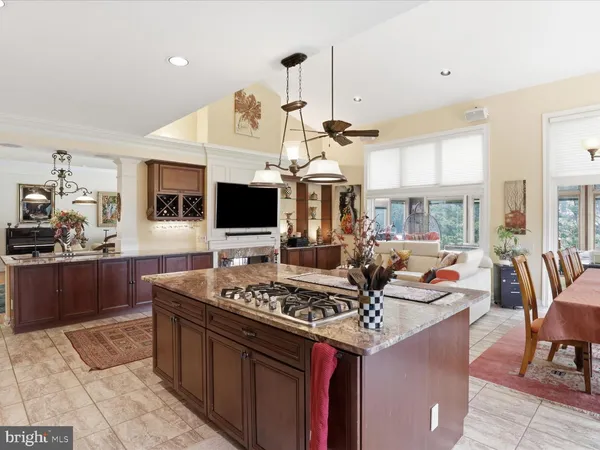a kitchen with a sink stove and view living room