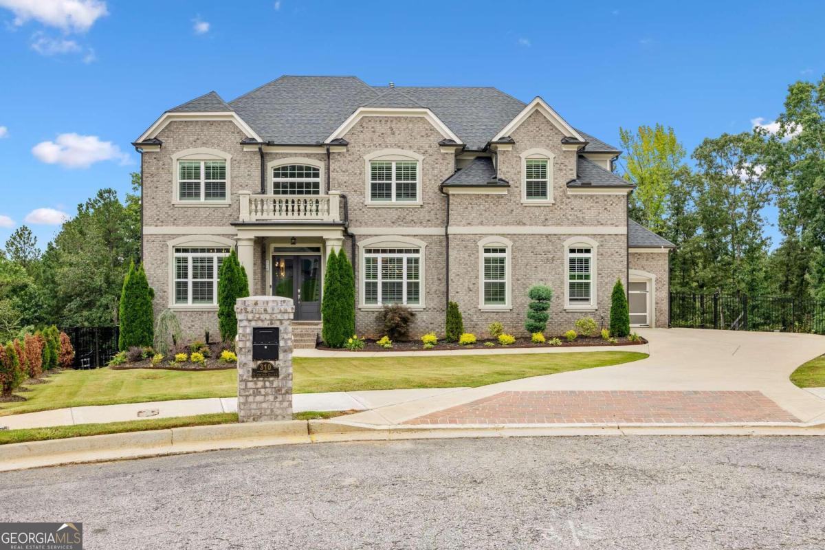 310 Eldwick Drive Southwest Atlanta, GA 30331 - Photo 1 of 1 a front view of a house with a yard and fountain