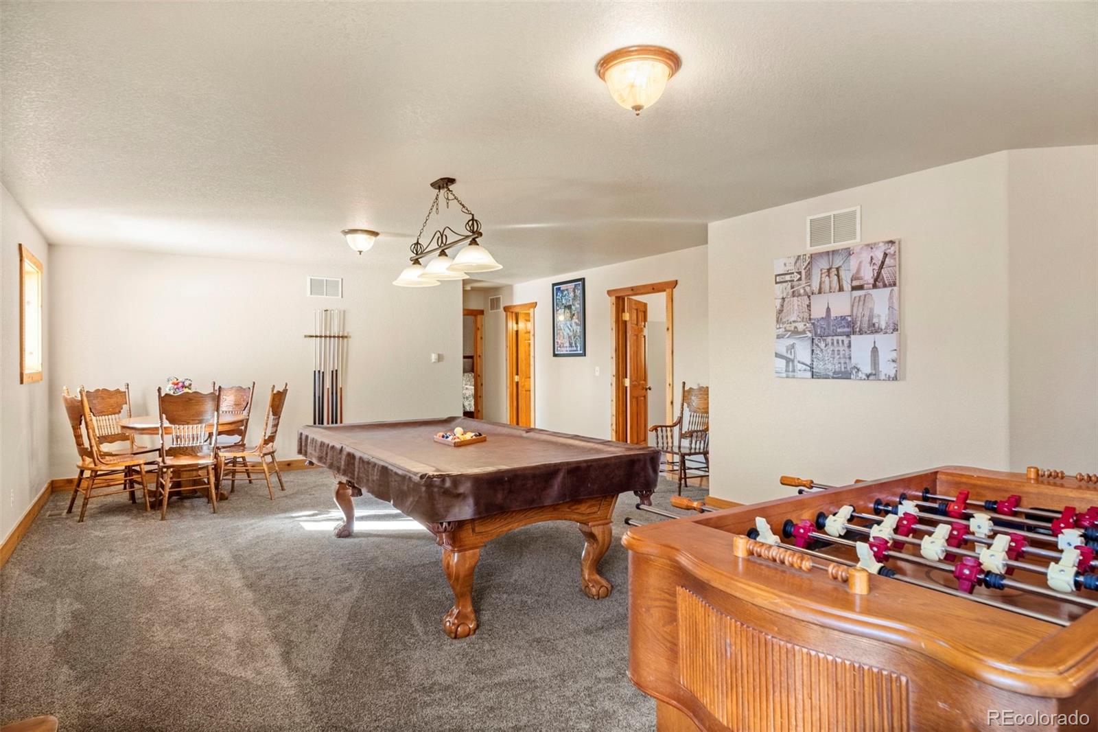 412 Evergreen Road Black Hawk, CO 80422 - Photo 35 of 48 a room with furniture pool table and chairs