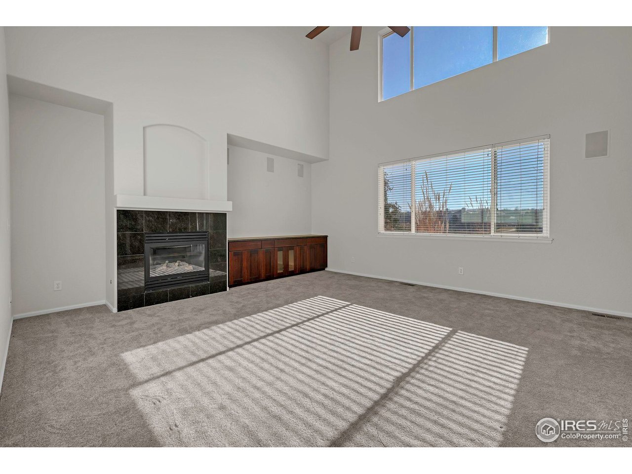 1936 Alpine Drive Erie, CO 80516 - Photo 16 of 47 a bedroom with a bed and a fireplace