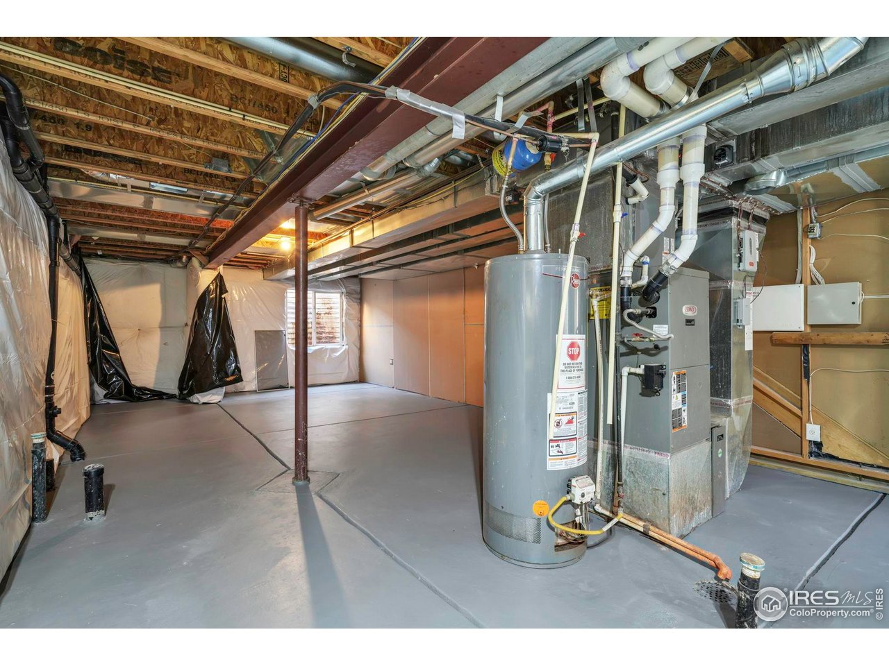 1936 Alpine Drive Erie, CO 80516 - Photo 38 of 47 a view of an empty room with wooden floor