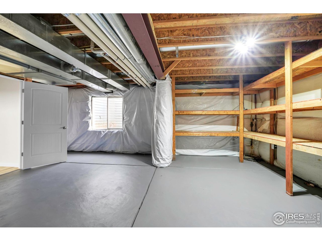 1936 Alpine Drive Erie, CO 80516 - Photo 39 of 47 a view of an empty room with a fireplace