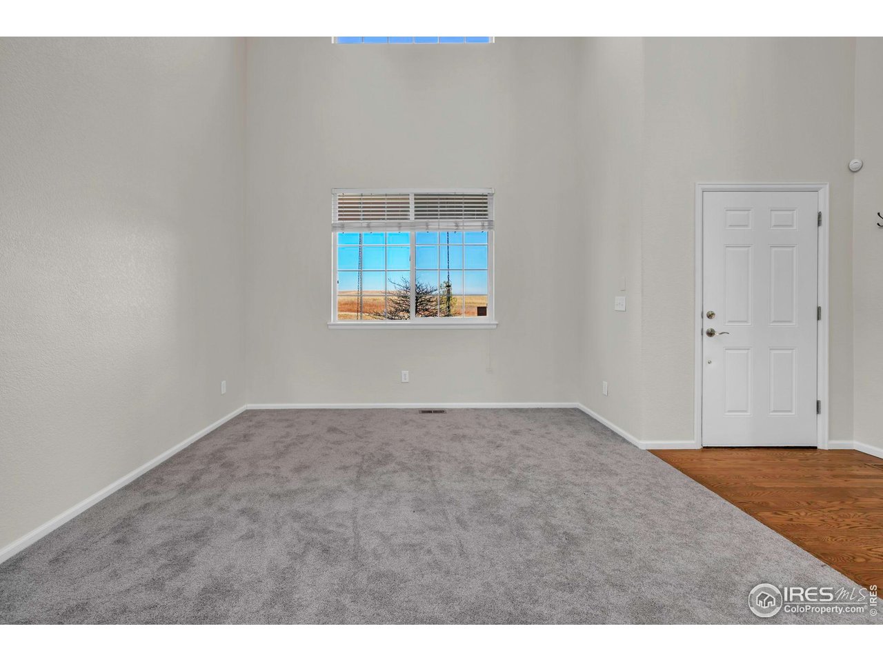 1936 Alpine Drive Erie, CO 80516 - Photo 7 of 47 a view of an empty room and window