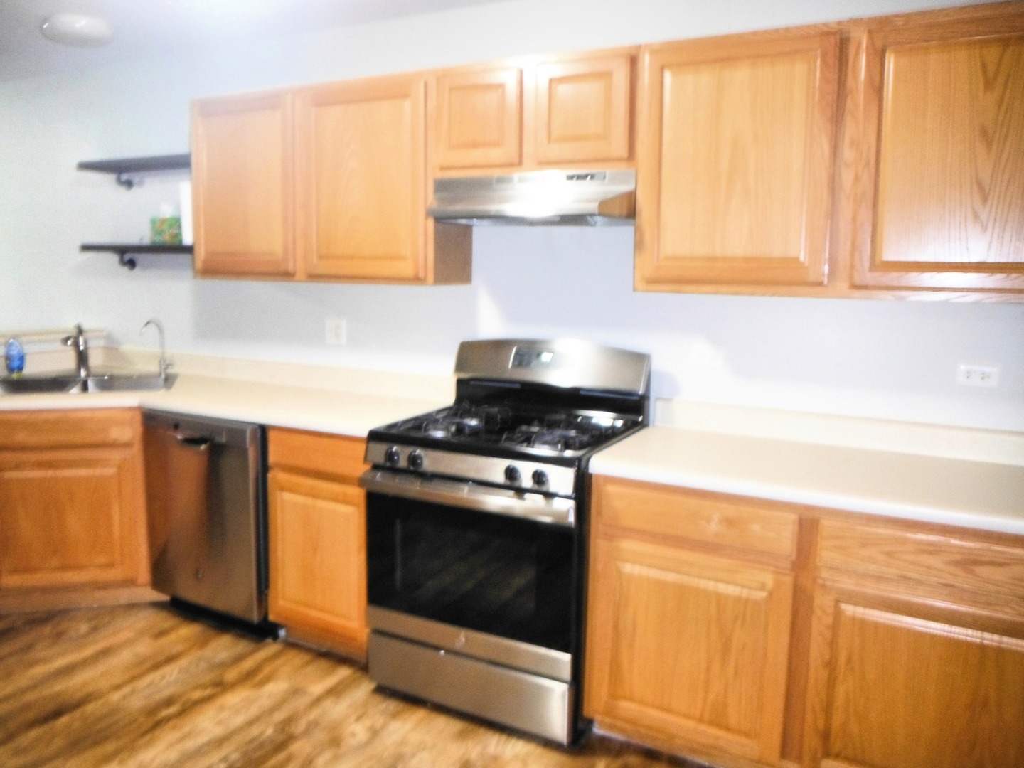 574 Boulder Drive Morris, IL 60450 - Photo 3 of 13 a kitchen with a stove and a sink