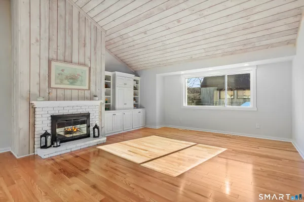 a bedroom with a bed and a fireplace