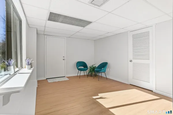 a view of a room with furniture and a potted plant