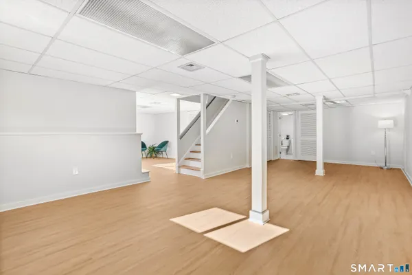 a view of a room with wooden floor