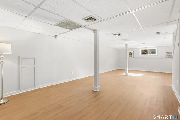 a view of a room with wooden floor