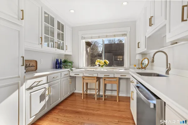 a kitchen with a sink and cabinets