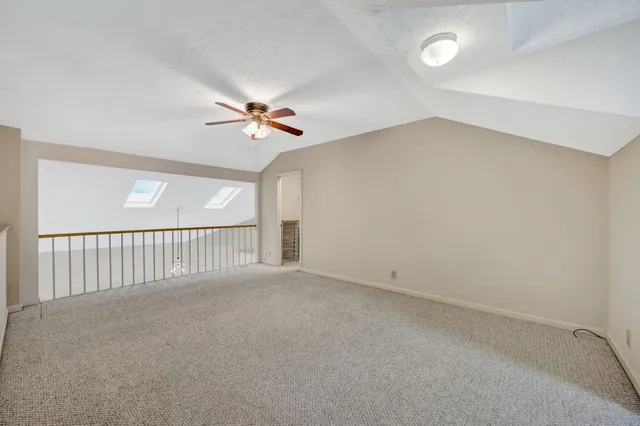a view of a big room with carpet