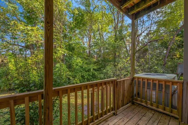 a view of balcony with wooden floor