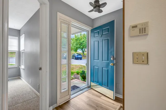 a view of entryway with wooden floor