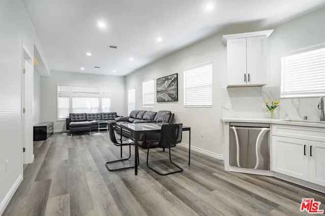 a workspace with furniture window and wooden floor