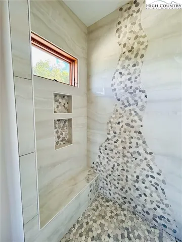 a view of a town with mountains in the background