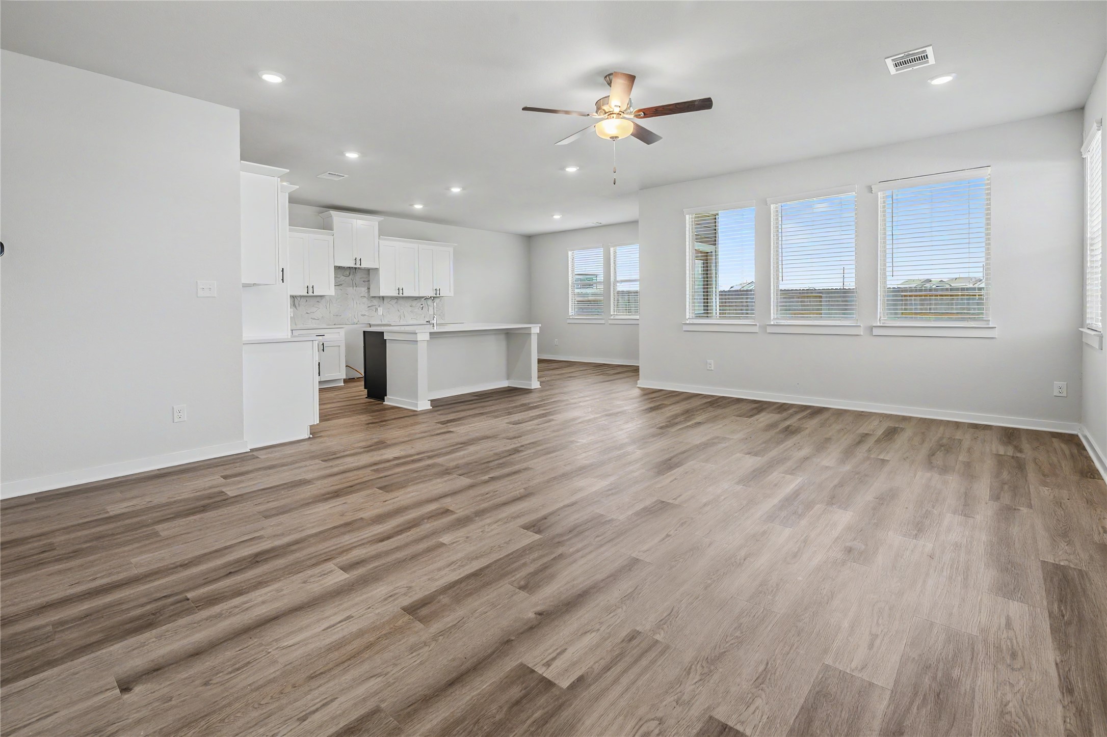 6427 Bolinas Court Rosharon, TX 77583 - Photo 12 of 49 a view of kitchen with wooden floor and window