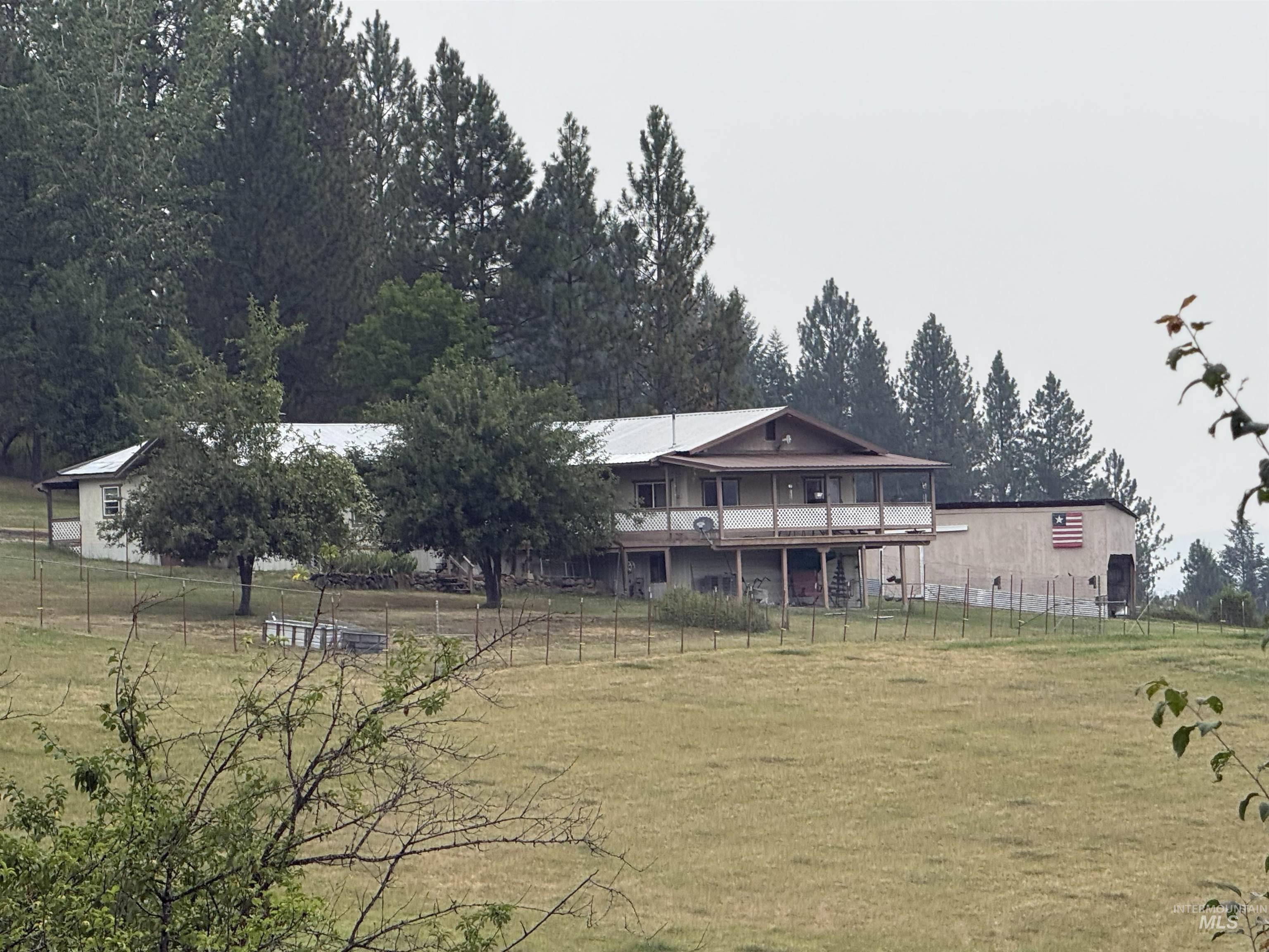 733 Pleasant Valley Road Stites, ID 83552 - Photo 5 of 46 Back covered deck, detached outbuilding, and expansive open fields