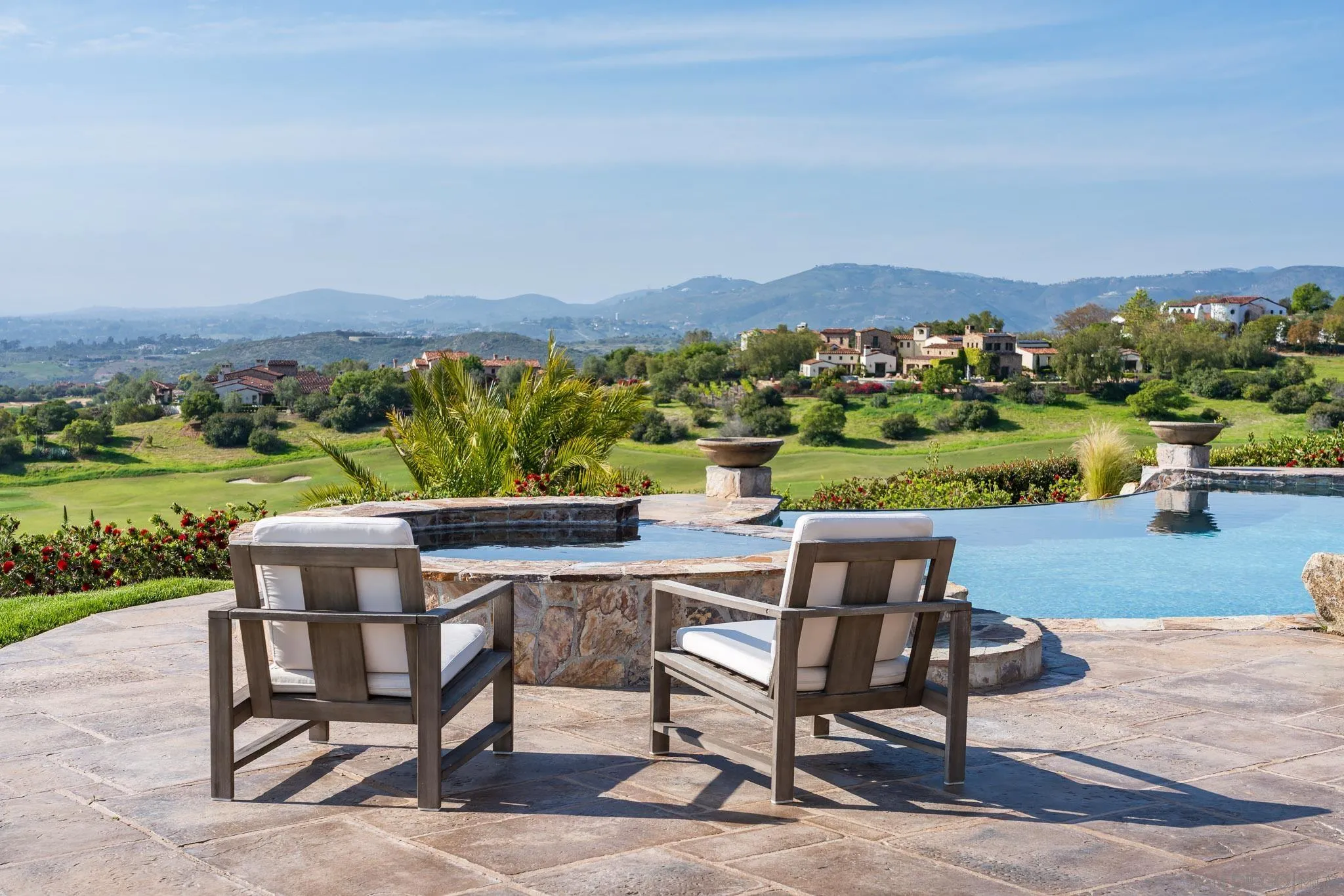 8415 Run Of The Knolls Court San Diego, CA 92127 - Photo 15 of 39 a view of a chairs and table in patio next to a yard