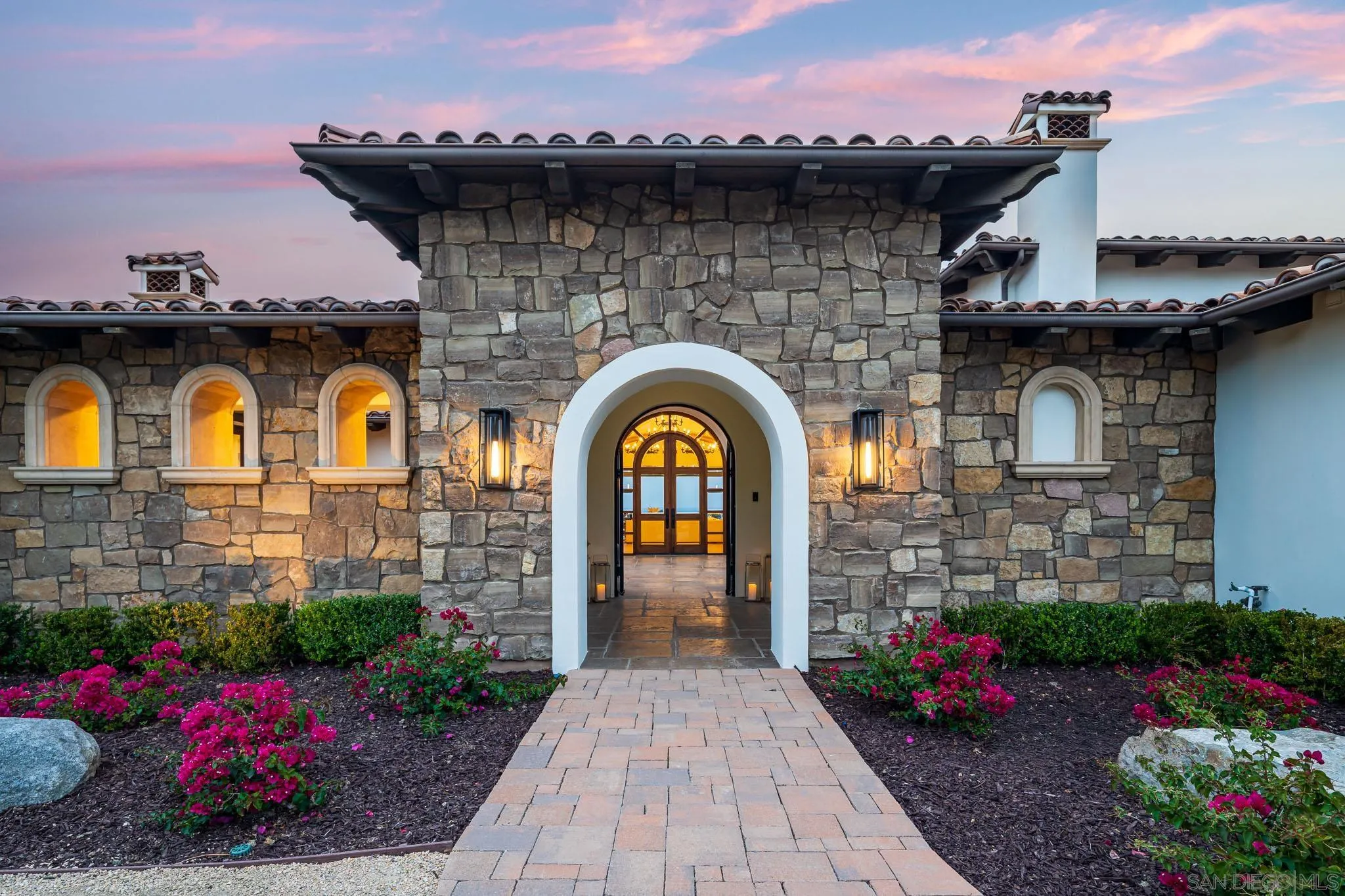 8415 Run Of The Knolls Court San Diego, CA 92127 - Photo 16 of 39 a front view of a house with a garden