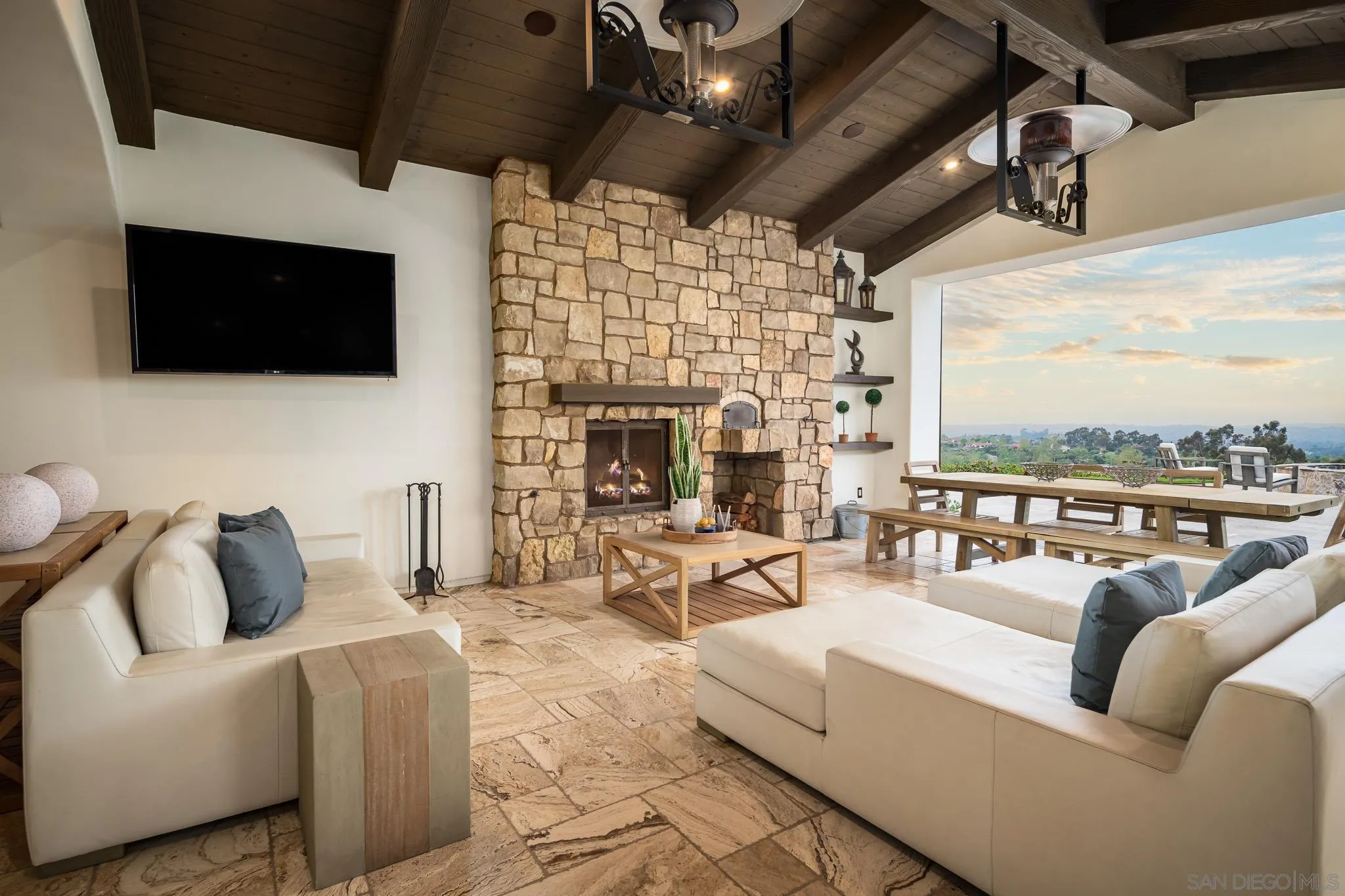 8415 Run Of The Knolls Court San Diego, CA 92127 - Photo 21 of 39 a living room with furniture a flat screen tv and a fireplace