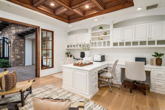 a workspace with furniture and kitchen view