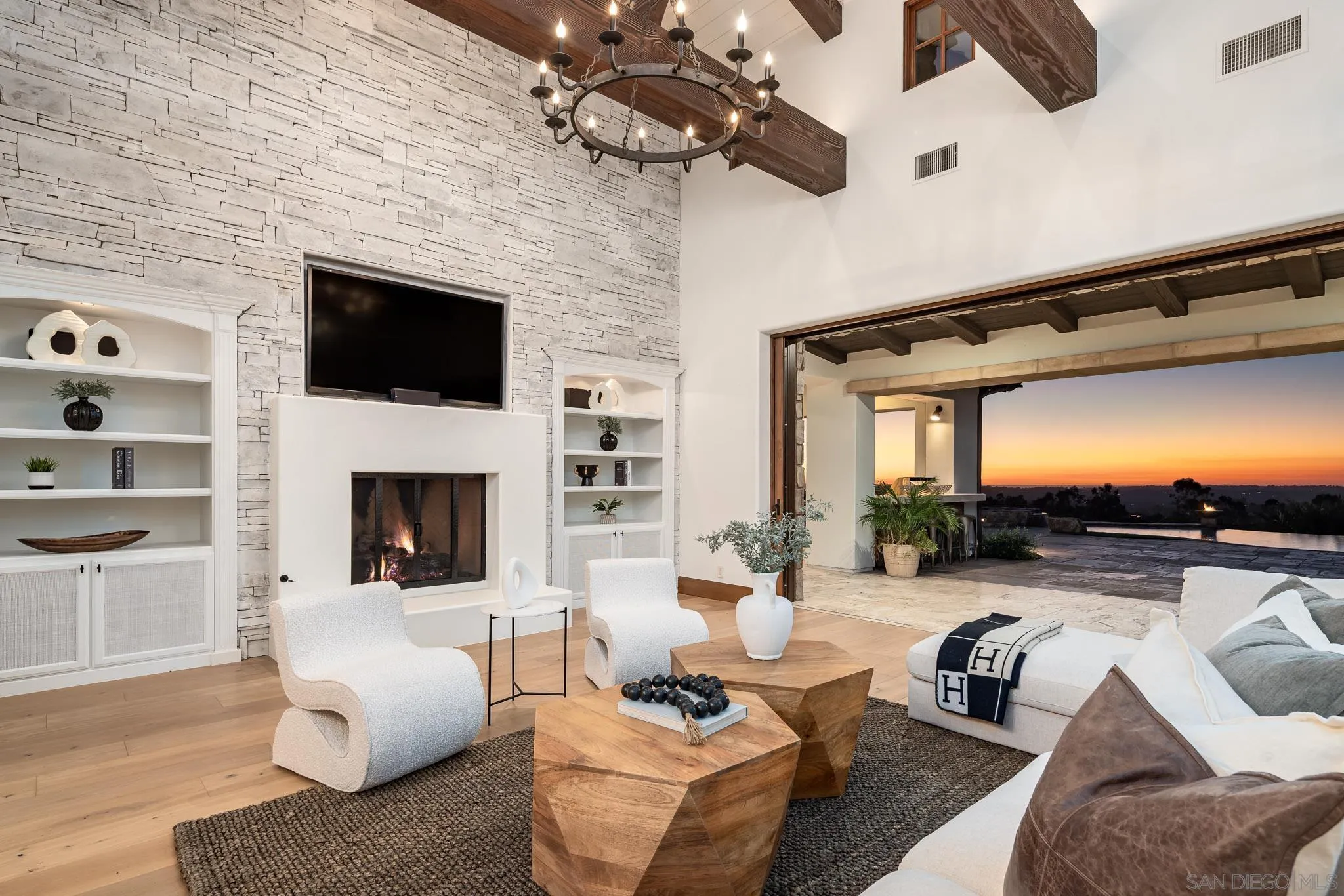 8415 Run Of The Knolls Court San Diego, CA 92127 - Photo 6 of 39 a living room with furniture a fireplace and a flat screen tv