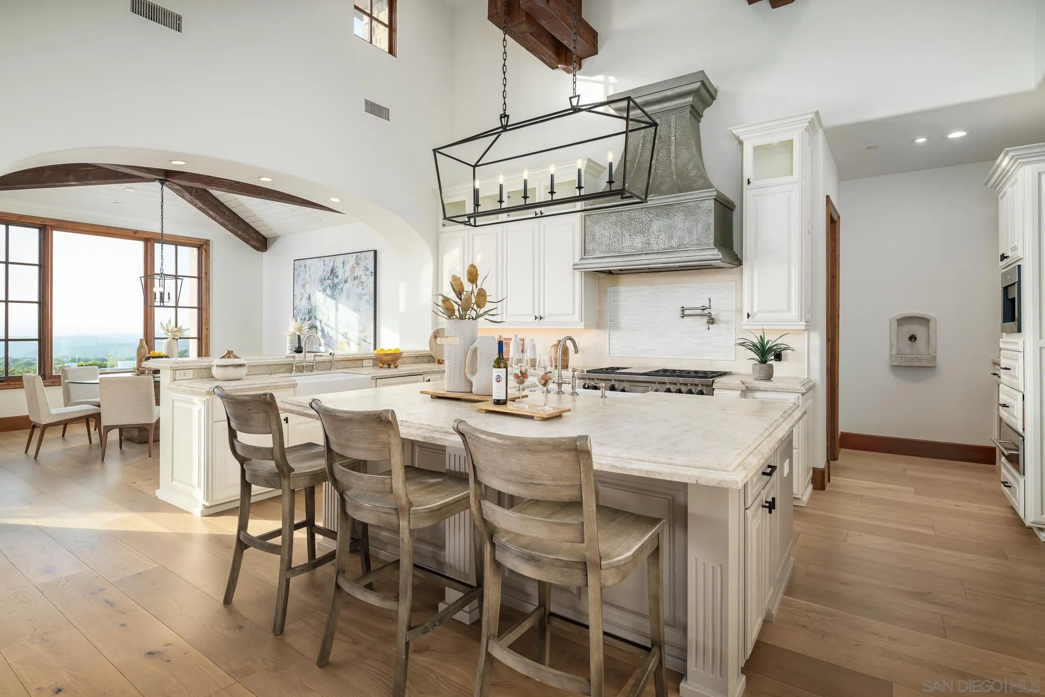 8415 Run Of The Knolls Court San Diego, CA 92127 - Photo 9 of 39 a large kitchen with a table and chairs