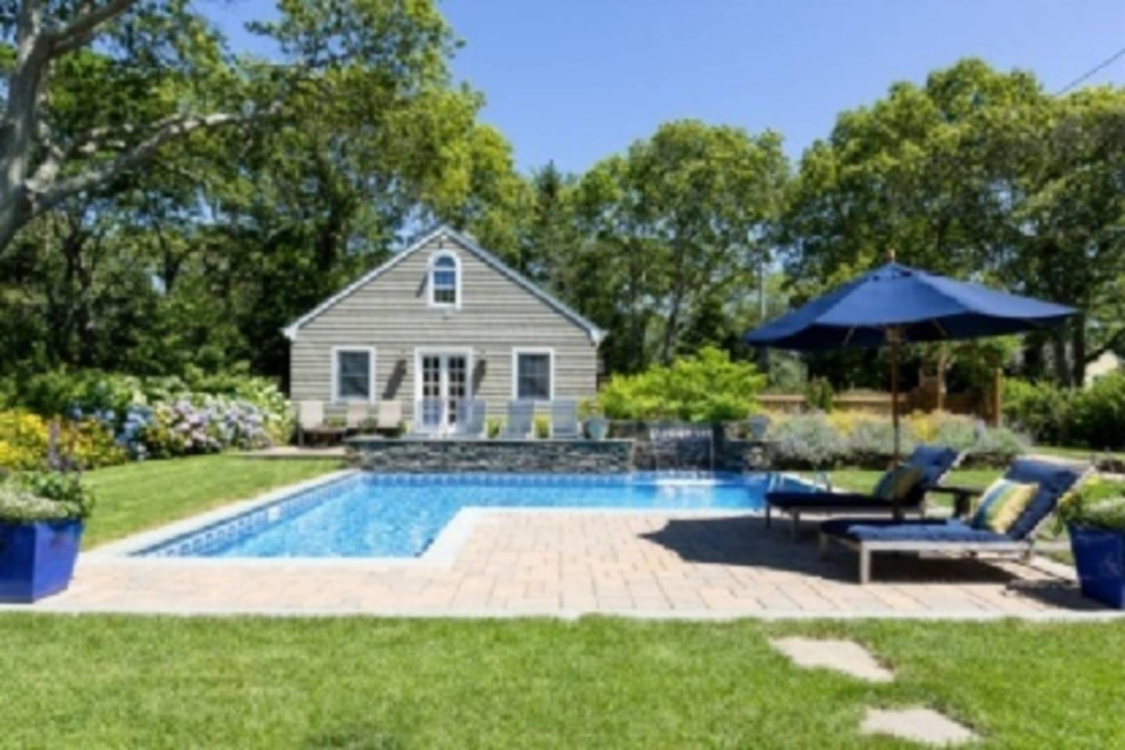 26 Wireless Road East Hampton, NY 11937 - Photo 2 of 13 a front view of house with yard and outdoor seating