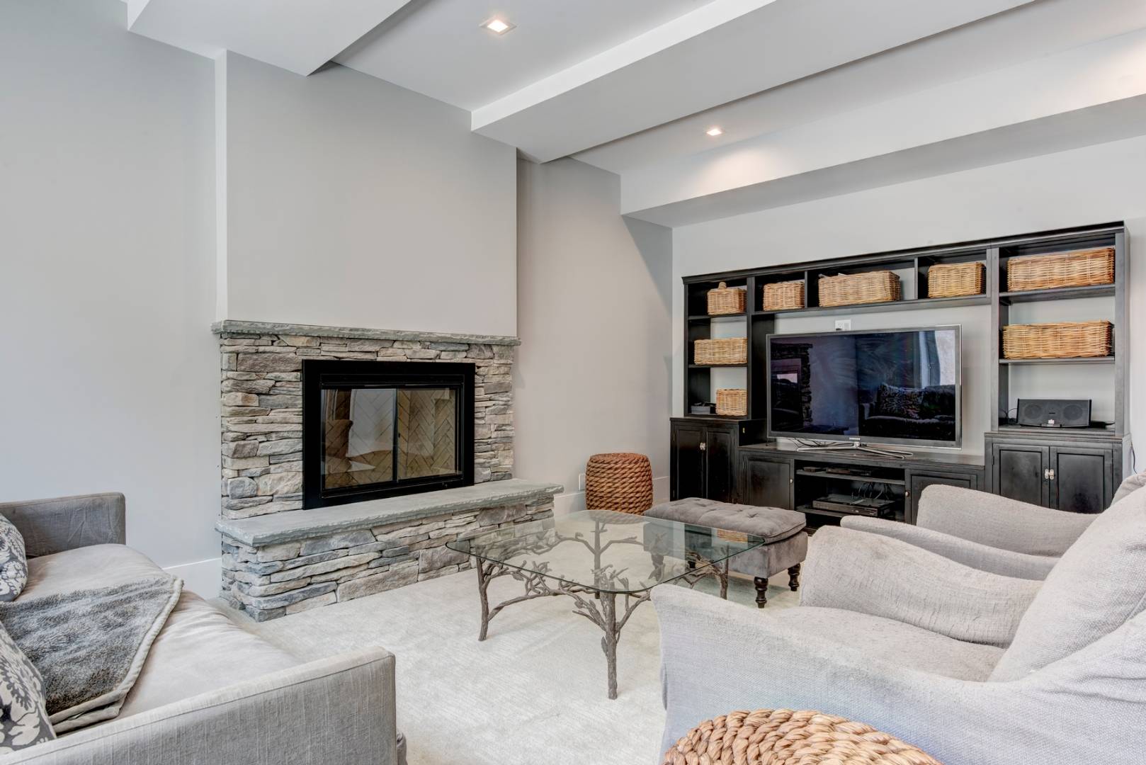 26 Wireless Road East Hampton, NY 11937 - Photo 3 of 13 a living room with furniture a flat screen tv and a fireplace