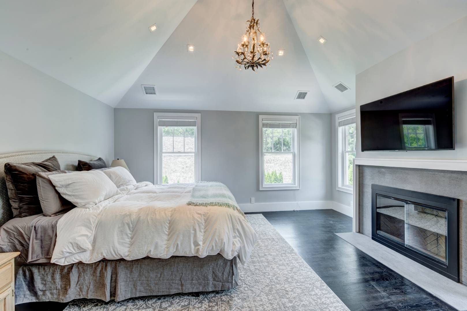 26 Wireless Road East Hampton, NY 11937 - Photo 6 of 13 a spacious bedroom with a bed and a fireplace