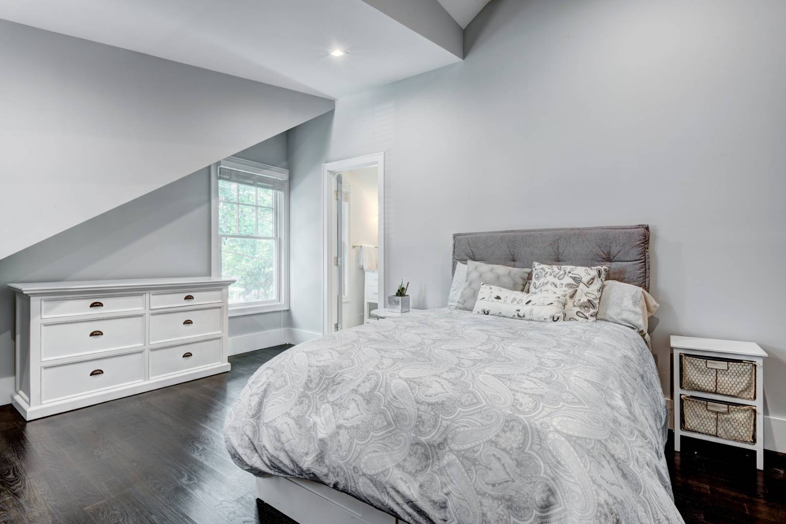 26 Wireless Road East Hampton, NY 11937 - Photo 8 of 13 a large bed sitting in a bedroom next to a window with dresser