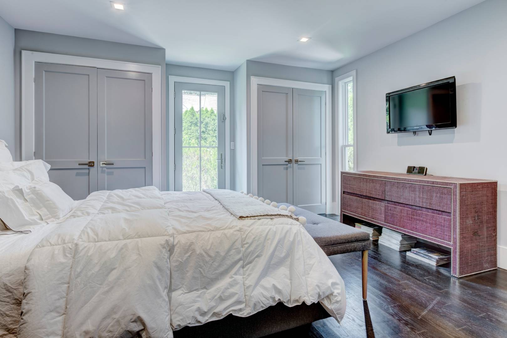 26 Wireless Road East Hampton, NY 11937 - Photo 9 of 13 a bedroom with a bed and a flat screen tv