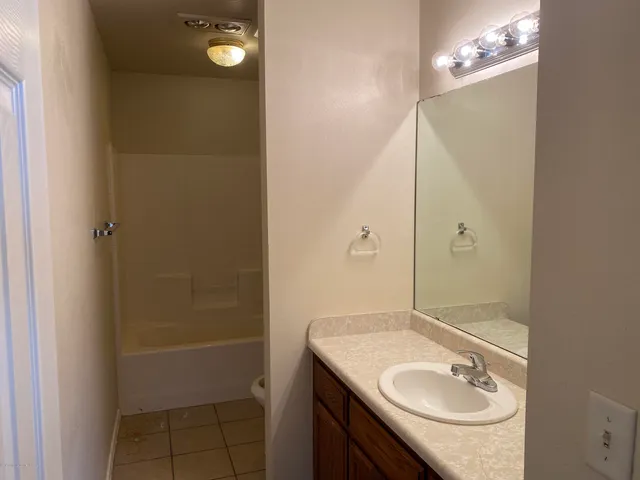 a bathroom with a sink double vanity and a mirror