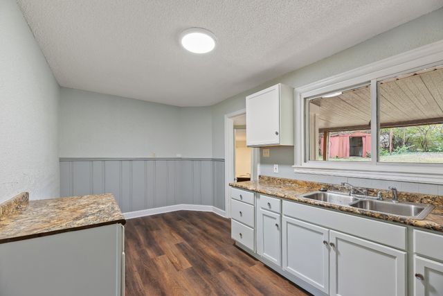 a kitchen with a sink and cabinets