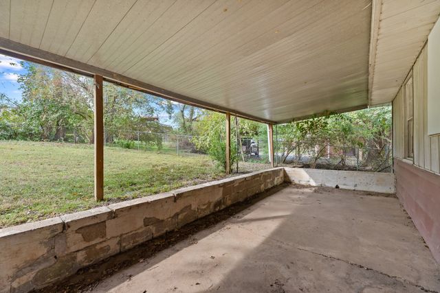 a view of an empty room with a large window