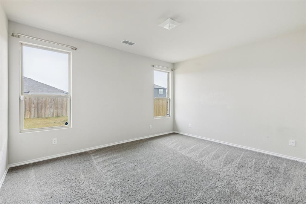 969 Ravenwood Lane Van Alstyne, TX 75495 - Photo 12 of 27 a view of an empty room with a window