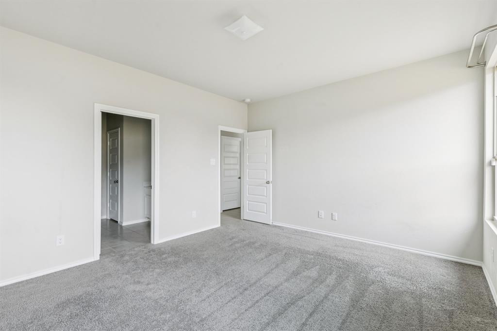 969 Ravenwood Lane Van Alstyne, TX 75495 - Photo 13 of 27 a view of an empty room and fire place