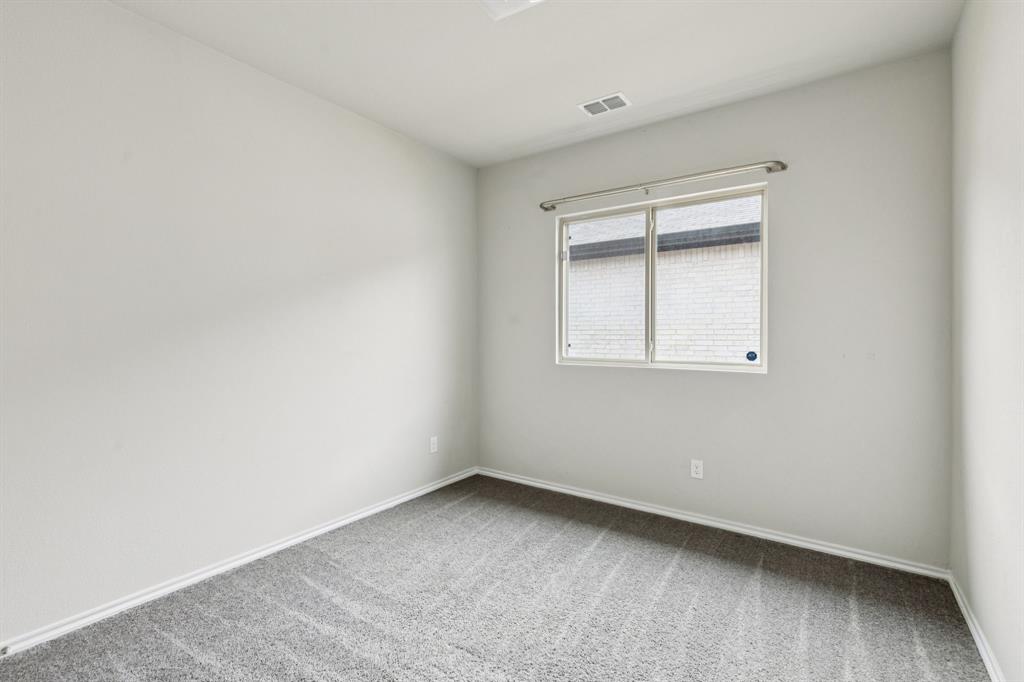 969 Ravenwood Lane Van Alstyne, TX 75495 - Photo 19 of 27 a view of an empty room with a window