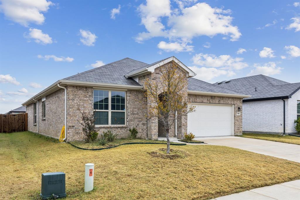969 Ravenwood Lane Van Alstyne, TX 75495 - Photo 2 of 27 a front view of a house with a yard